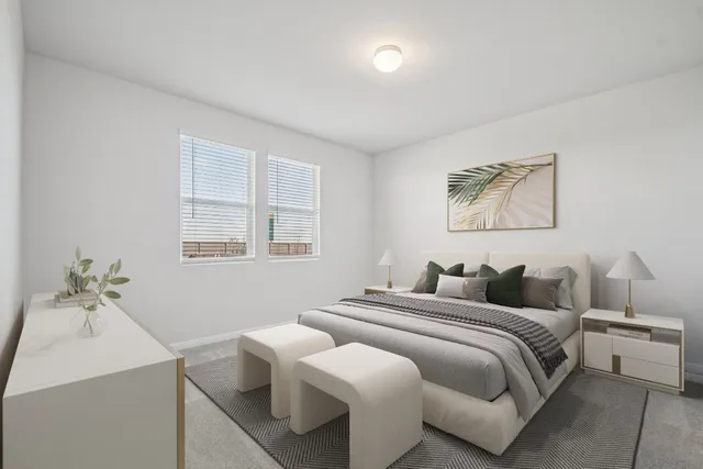 a bedroom with a bed and view