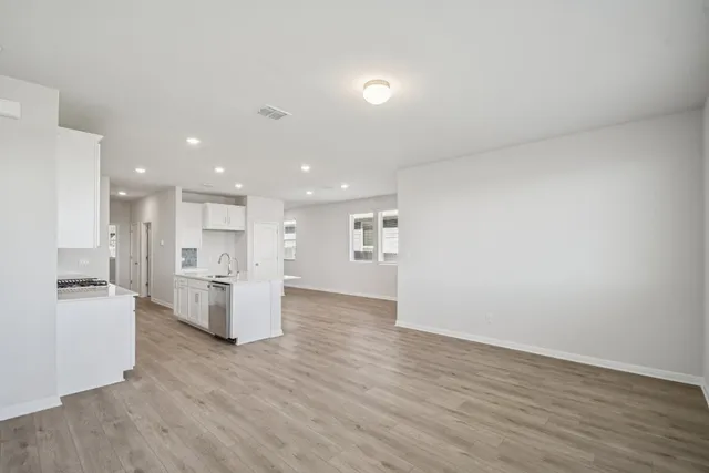 a view of kitchen with wooden floor