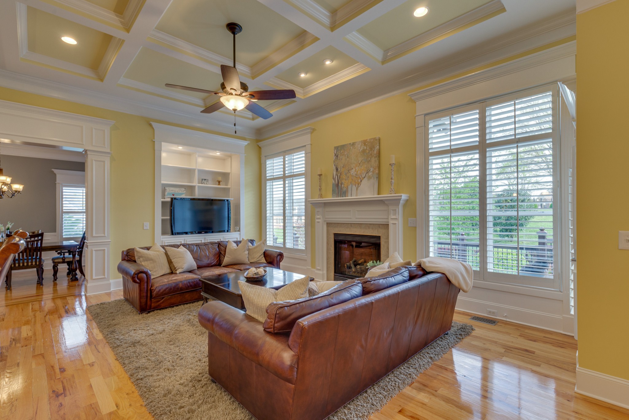 1052 Fitzroy Circle Spring Hill, TN 37174 - Photo 11 of 44 a living room with furniture a chandelier and a fireplace