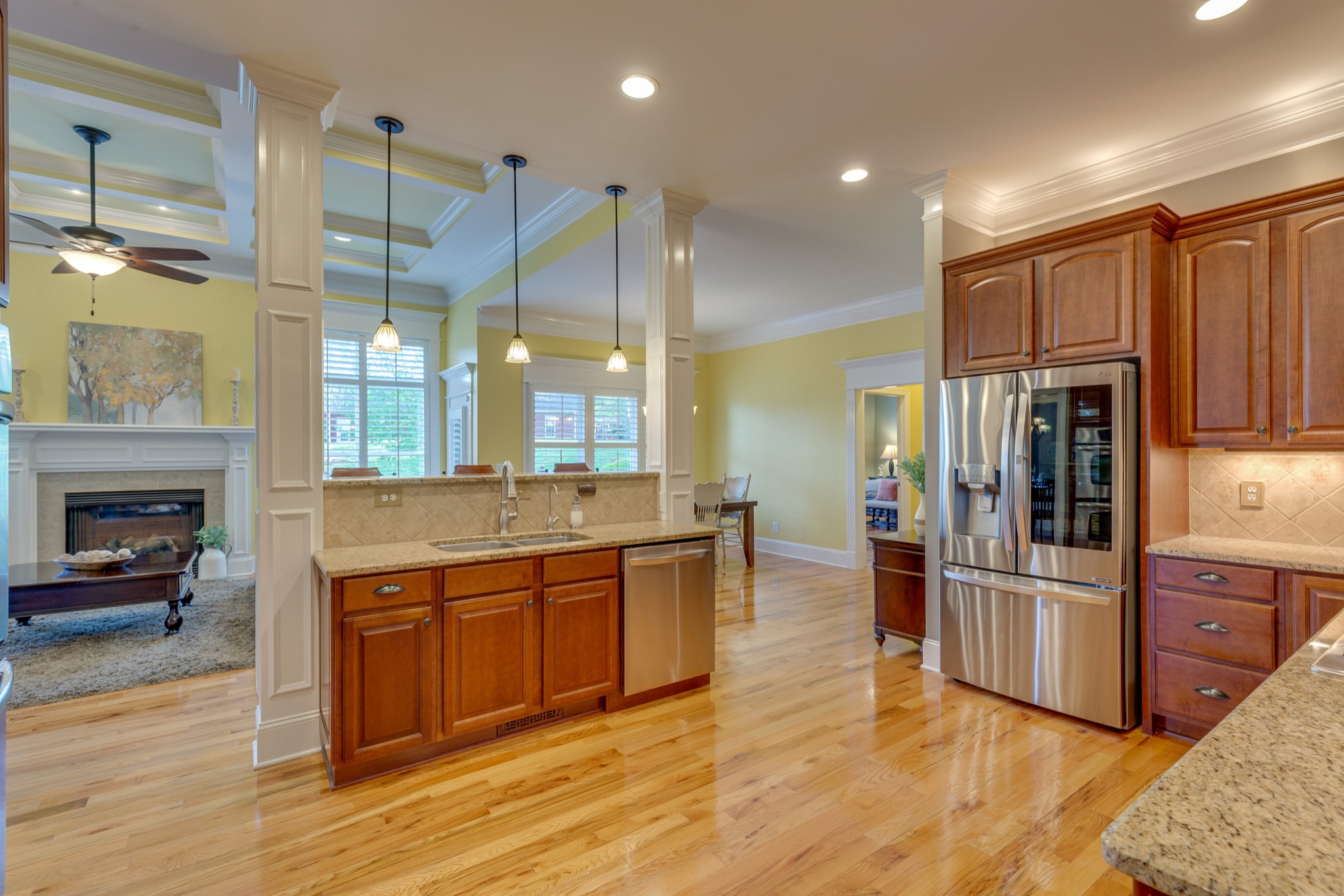 1052 Fitzroy Circle Spring Hill, TN 37174 - Photo 13 of 44 a kitchen with stainless steel appliances granite countertop a refrigerator a stove and a wooden floors