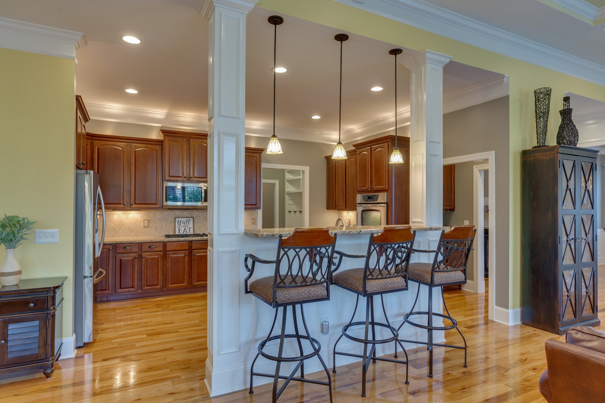 1052 Fitzroy Circle Spring Hill, TN 37174 - Photo 14 of 44 a dining room with stainless steel appliances furniture a rug and a kitchen view