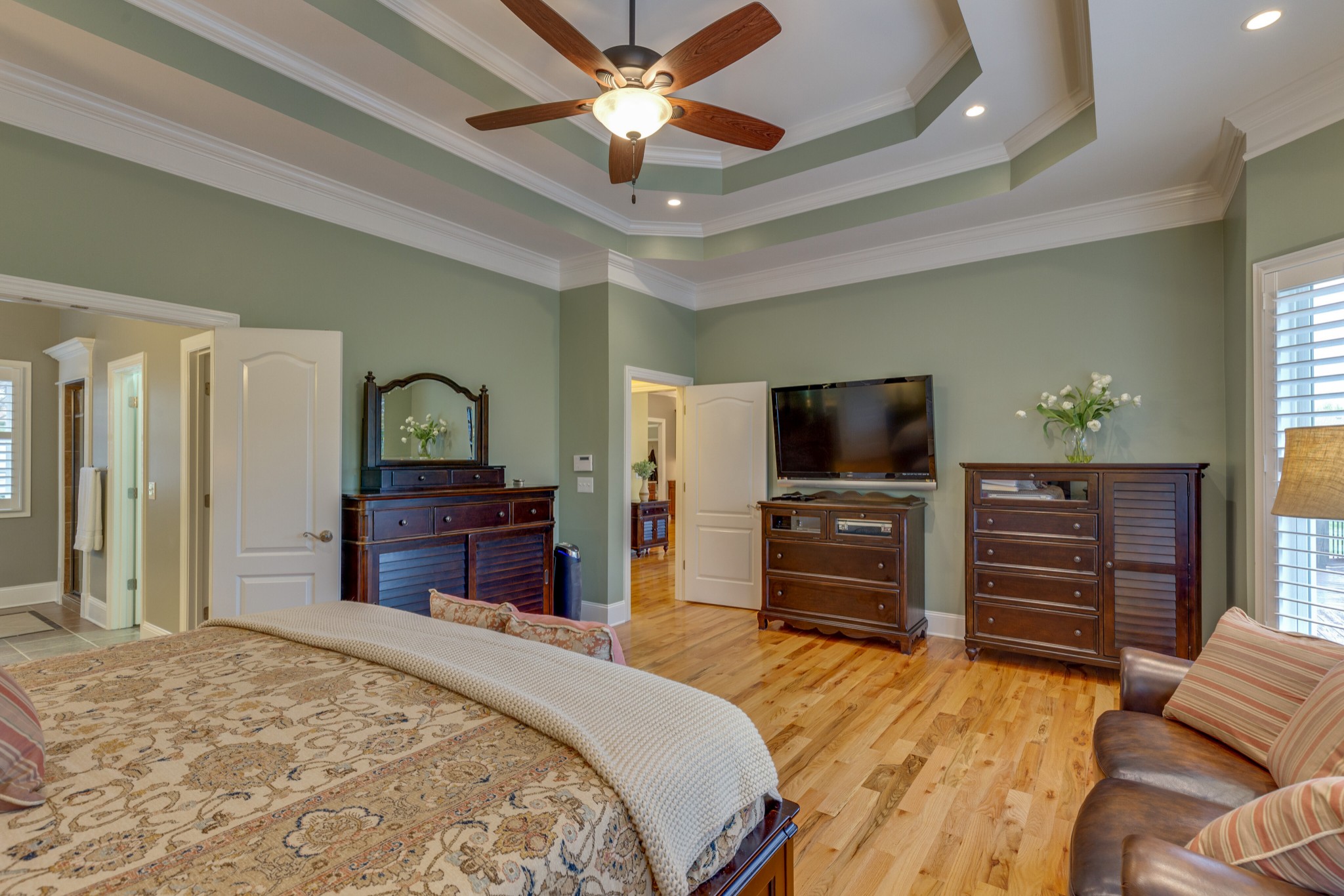 1052 Fitzroy Circle Spring Hill, TN 37174 - Photo 19 of 44 a bedroom with furniture and a flat screen tv