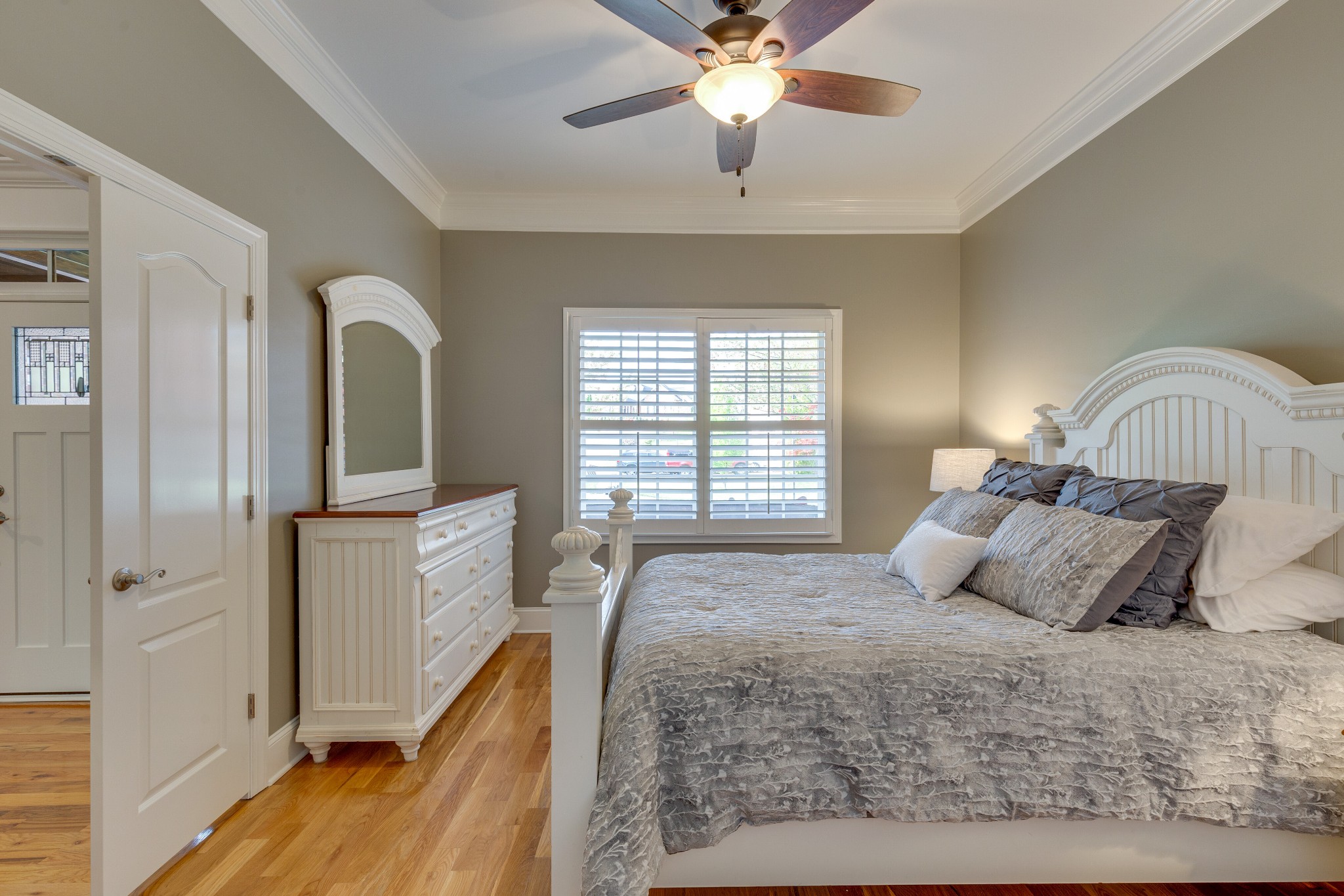 1052 Fitzroy Circle Spring Hill, TN 37174 - Photo 22 of 44 a bedroom with a large bed and a chandelier