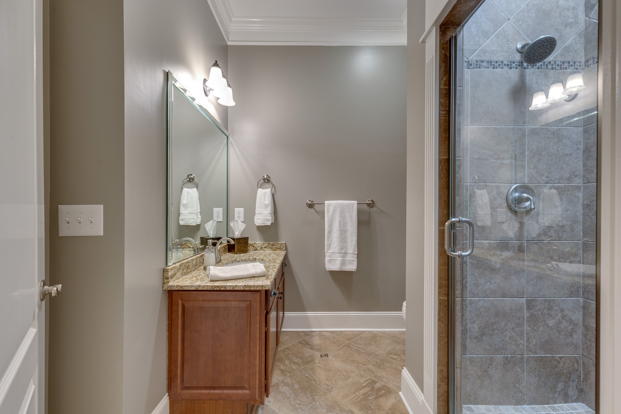 1052 Fitzroy Circle Spring Hill, TN 37174 - Photo 23 of 44 a bathroom with a sink vanity and tub