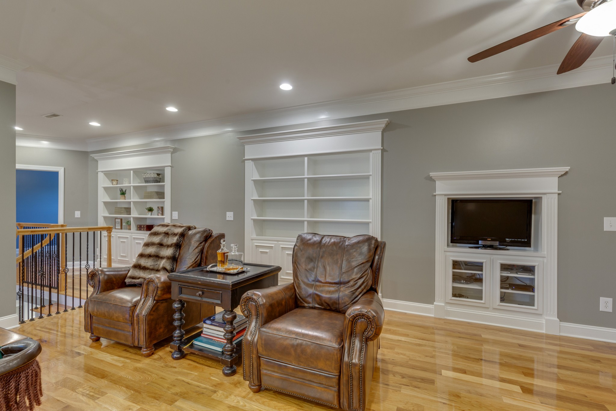 1052 Fitzroy Circle Spring Hill, TN 37174 - Photo 29 of 44 a living room with furniture a flat screen tv and kitchen view