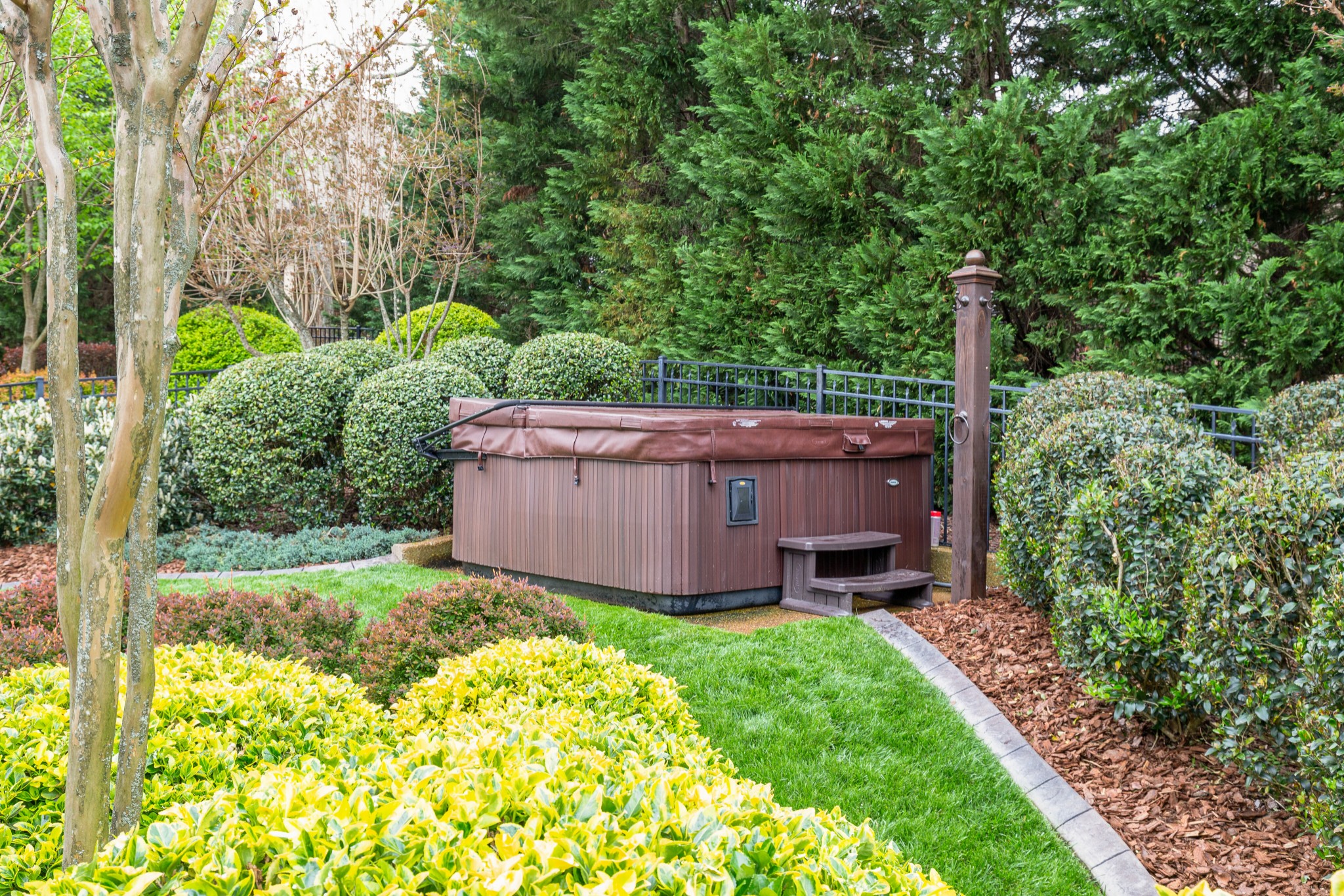 1052 Fitzroy Circle Spring Hill, TN 37174 - Photo 37 of 44 a view of a backyard with wooden fence and a bench