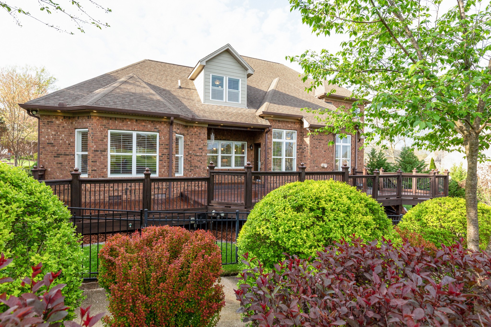 1052 Fitzroy Circle Spring Hill, TN 37174 - Photo 40 of 44 a front view of a house with garden