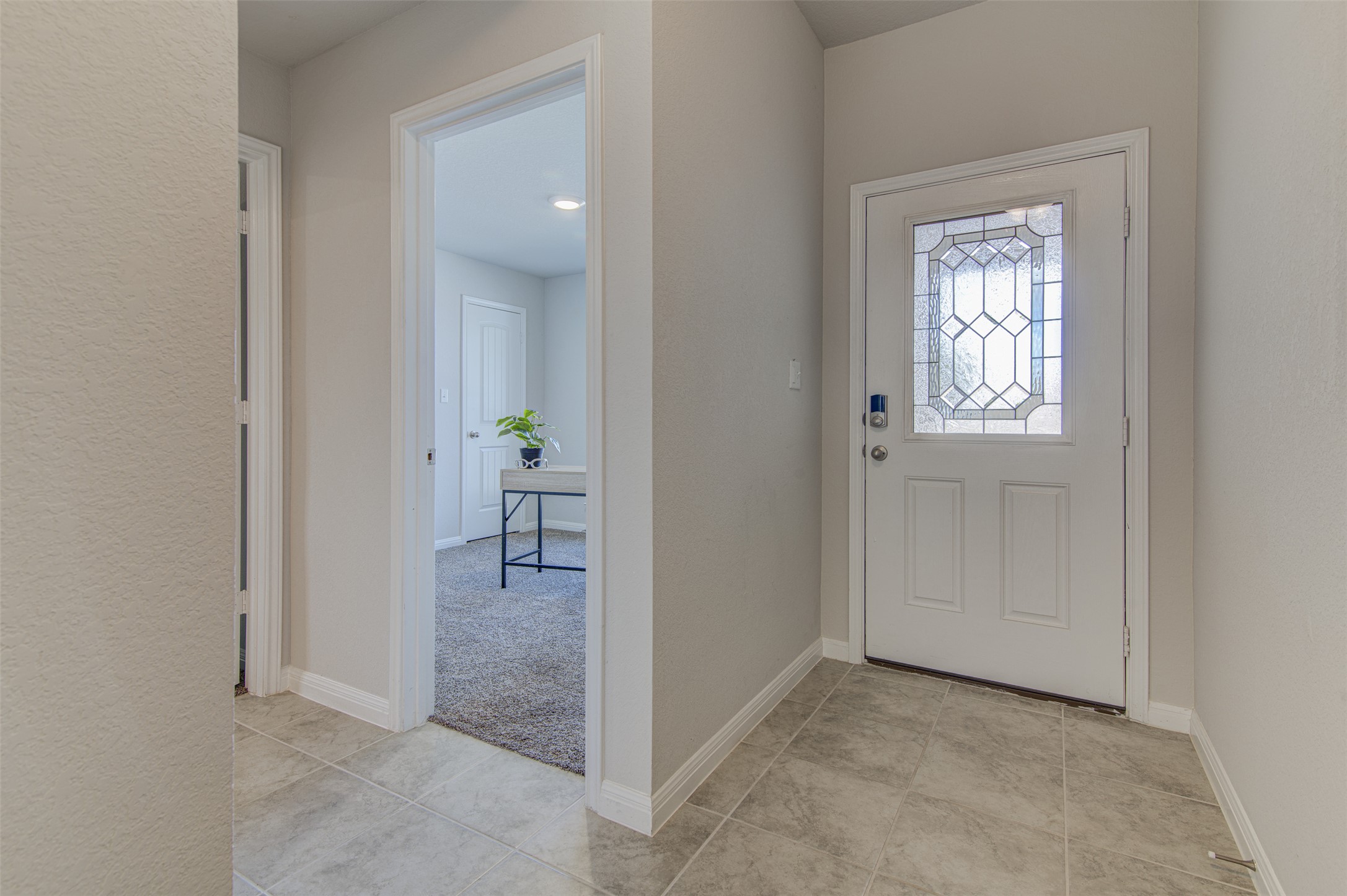 316 Pepper Mill Loop Burnet, TX 78611 - Photo 16 of 27 A welcoming entry features elegant tile flooring and a decorative glass front door.