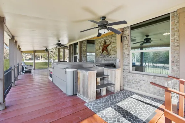 a view of a balcony with furniture