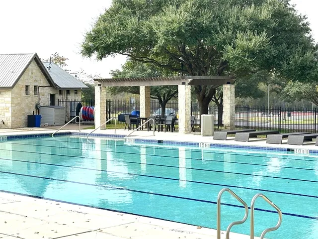 a view of a swimming pool with a patio