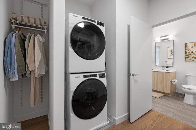 a view of a hallway with washer and dryer