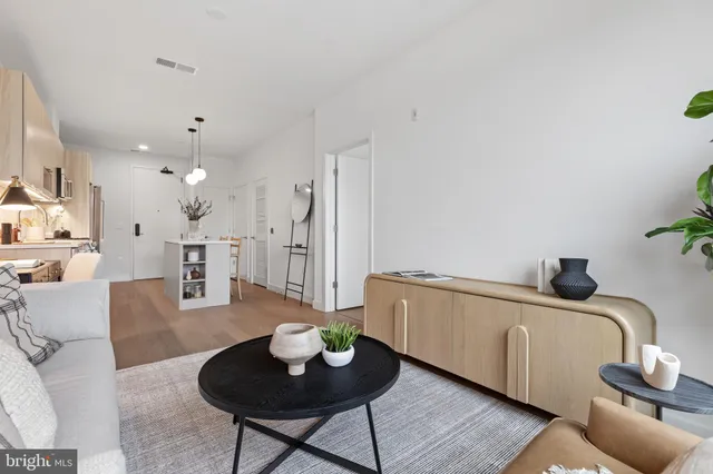 a living room with furniture and a table