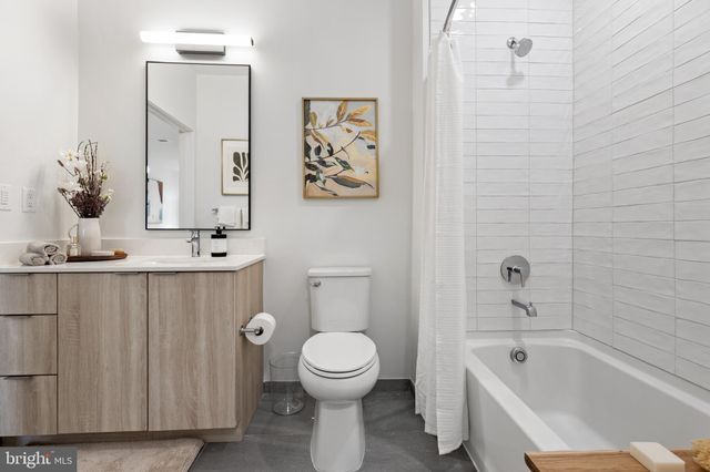 a bathroom with a toilet a sink and bathtub