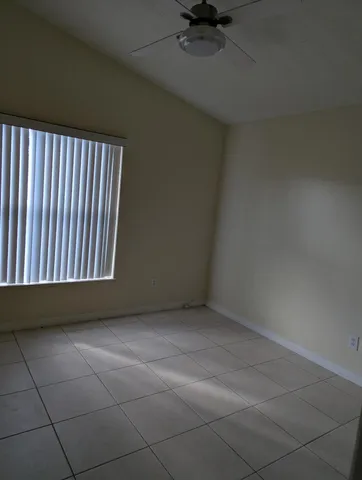 a view of an empty room and a window