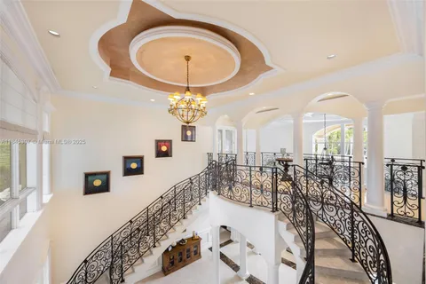 a dining room with stainless steel appliances kitchen island granite countertop a table and chairs