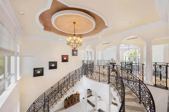 a dining room with stainless steel appliances kitchen island granite countertop a table and chairs