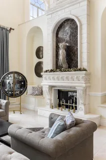 a bedroom with a bed and a flat tv screen on dresser