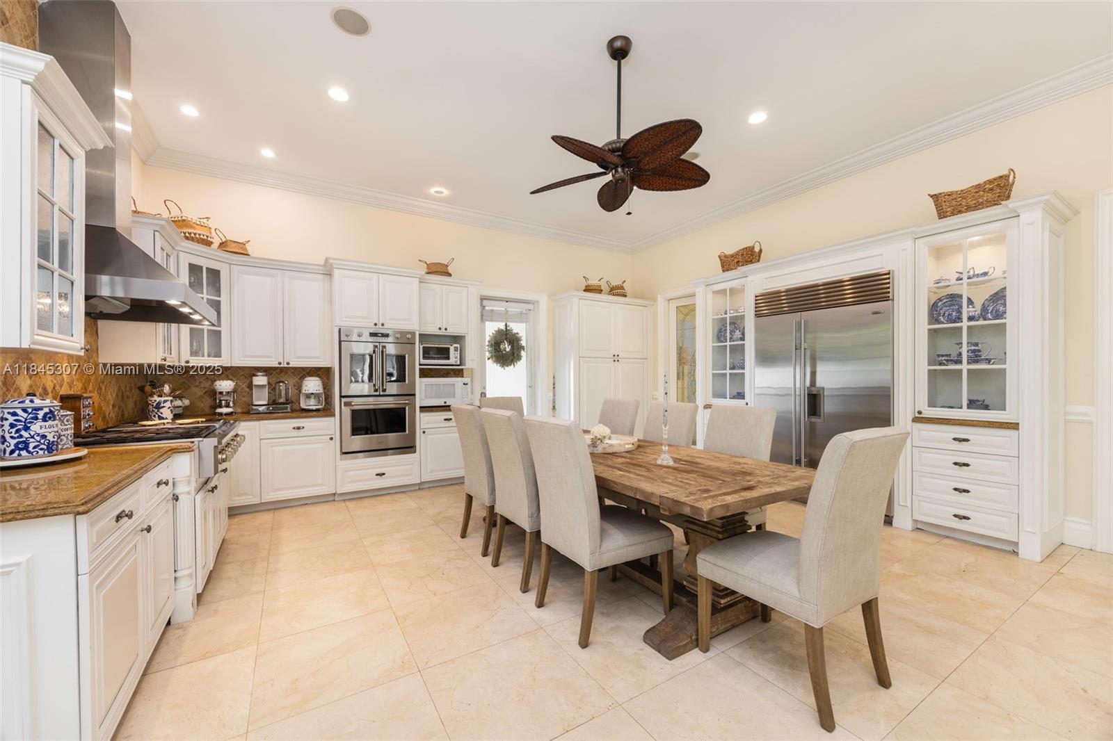0 7245 Southwest 104th Street Pinecrest, FL 33156 - Photo 34 of 74 a dining room with furniture and a large window