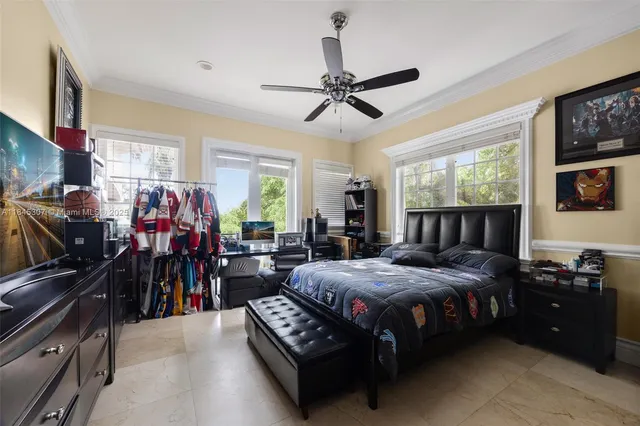 a bathroom with a sink a toilet a large mirror and a window