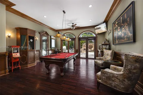 a view of a dining room with furniture wooden floor and chandelier