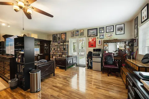 a front view of a house with garden and parking