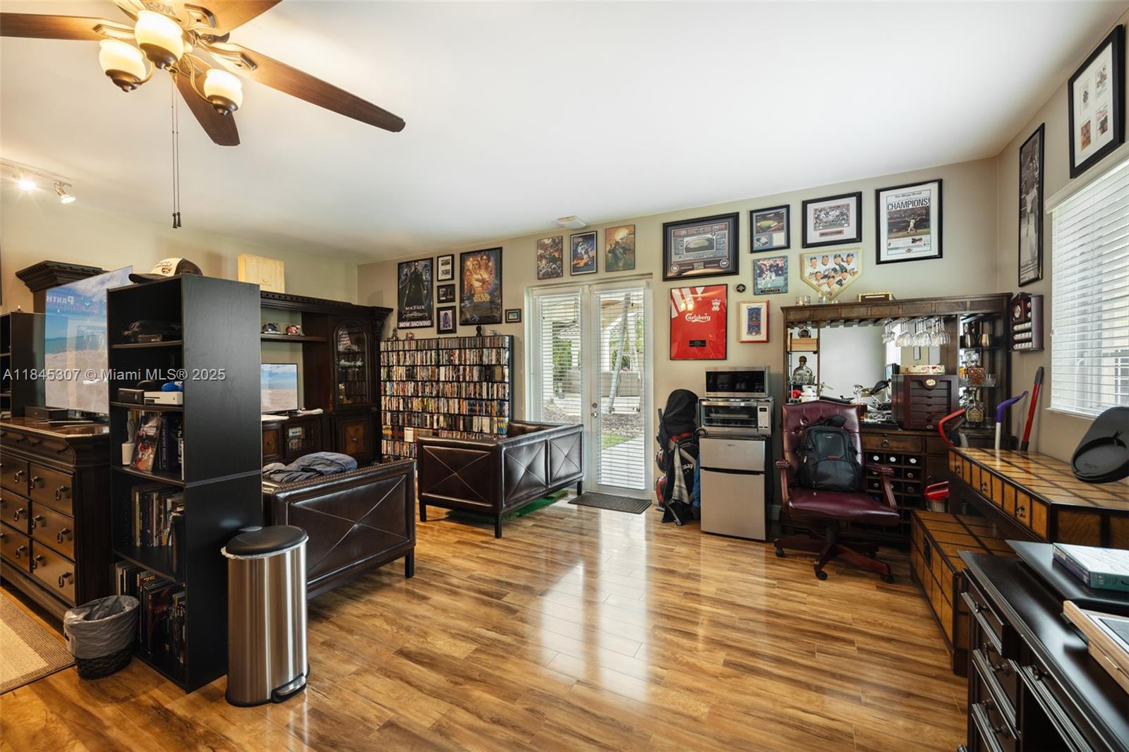 0 7245 Southwest 104th Street Pinecrest, FL 33156 - Photo 48 of 74 a view of a workspace with furniture and a livingroom