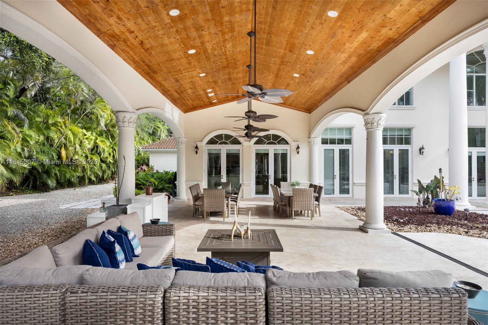 0 7245 Southwest 104th Street Pinecrest, FL 33156 - Photo 64 of 74 a view of a patio with couches table and chairs and potted plants