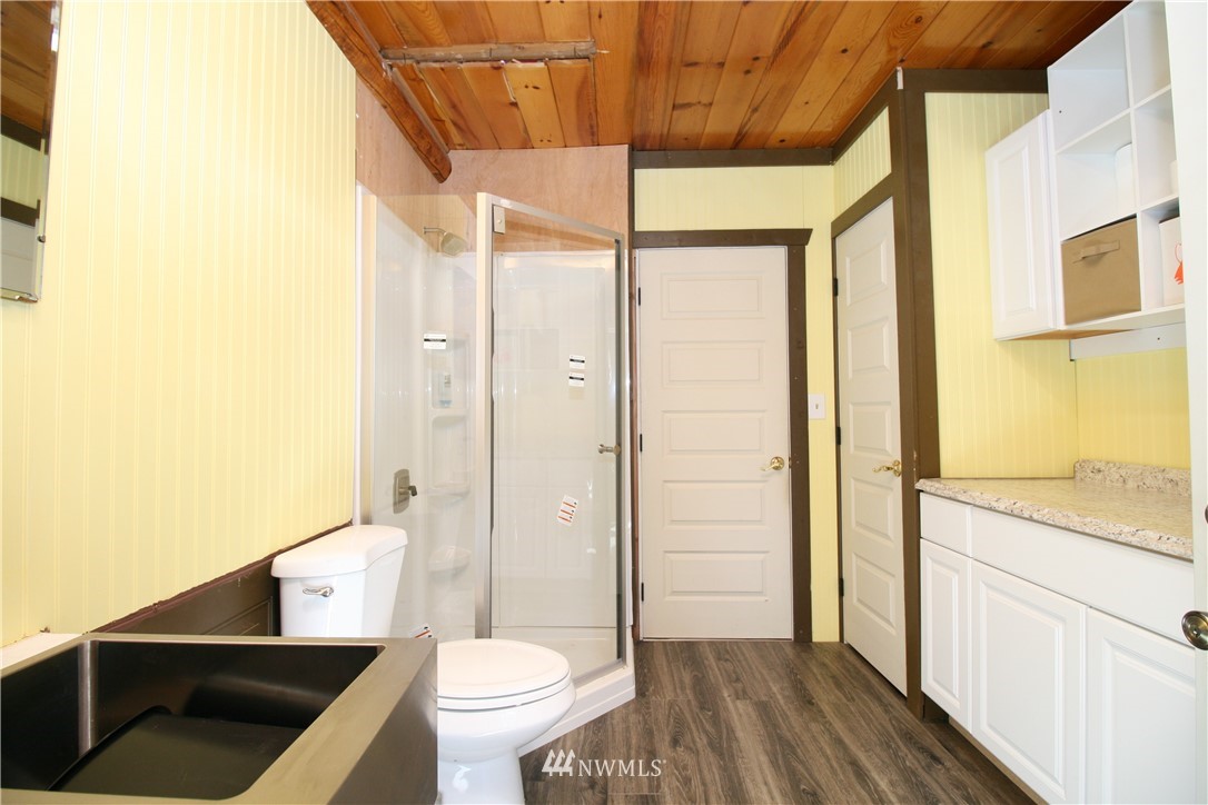1304 Radio Road Ellensburg, WA 98926 - Photo 15 of 26 a bathroom with a granite countertop sink toilet and shower