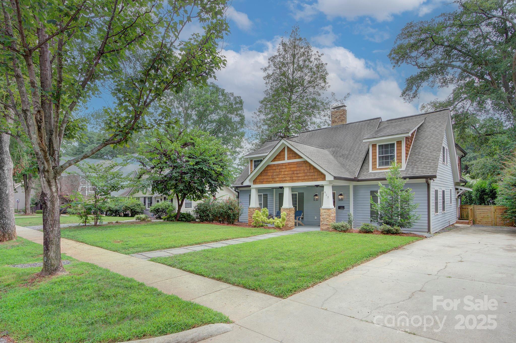823 Sedgefield Road Charlotte, NC 28209 - Photo 4 of 38 a front view of a house with a yard