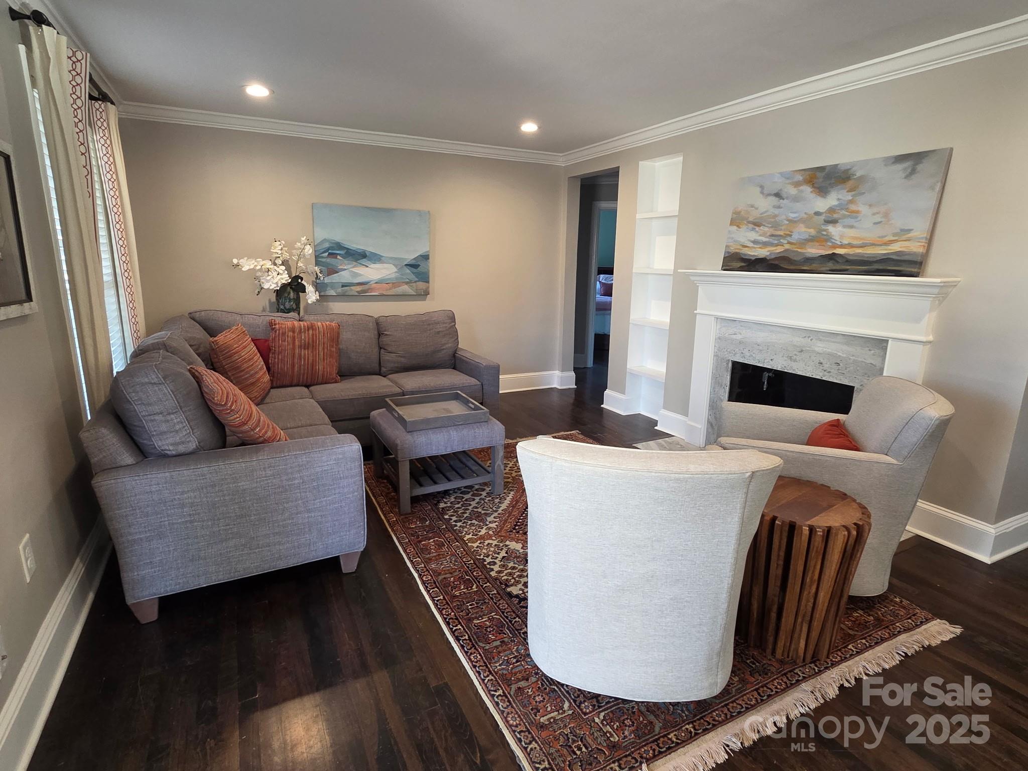 823 Sedgefield Road Charlotte, NC 28209 - Photo 8 of 38 a living room with furniture and a fireplace