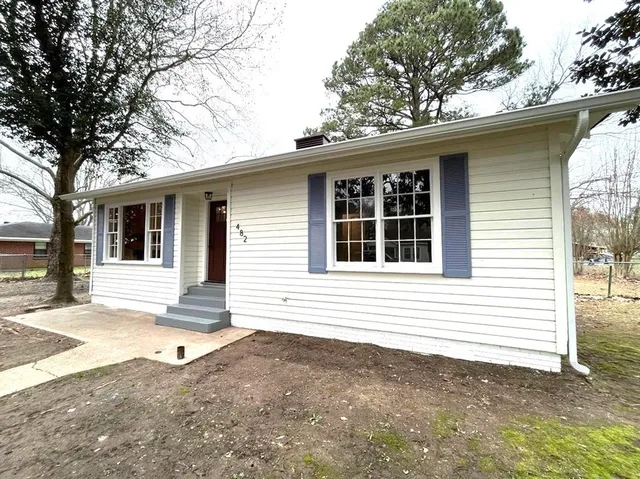 a front view of a house with a garage