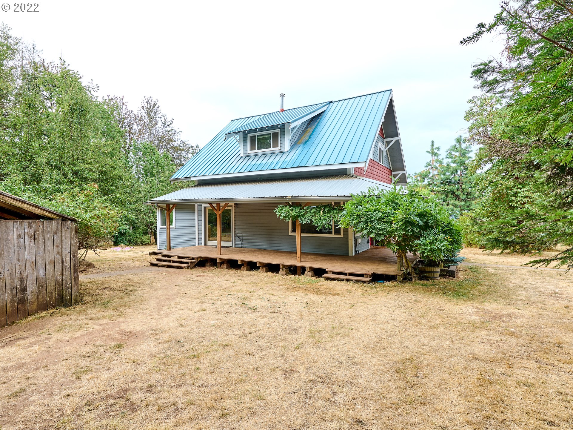 22350 South Bee Hill Road Colton, OR 97017 - Photo 5 of 32 a view of a house with a patio and backyard