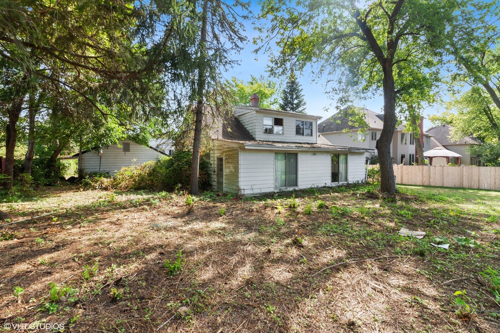 5S578 Tuthill Road Naperville, IL 60563 - Photo 11 of 23 a front view of a house with a garden