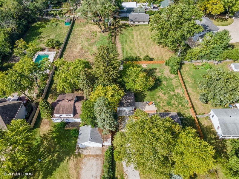 5S578 Tuthill Road Naperville, IL 60563 - Photo 21 of 23 an aerial view of residential houses with outdoor space and trees all around