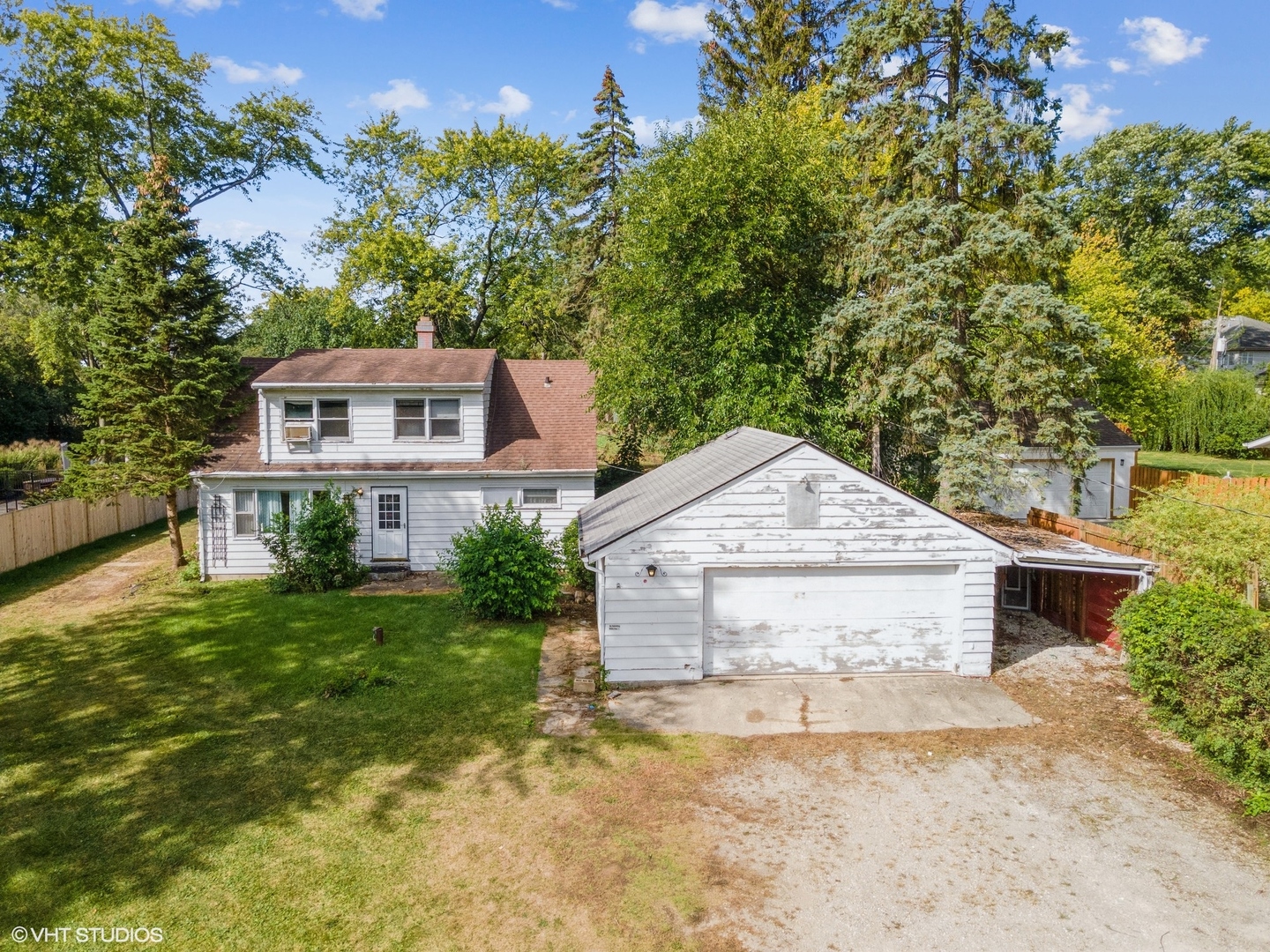 5S578 Tuthill Road Naperville, IL 60563 - Photo 5 of 23 a front view of a house with a yard and trees
