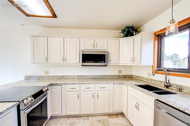 3780 Range View Road Monument, CO 80132 - Photo 14 of 33 New granite counters in kitchen.