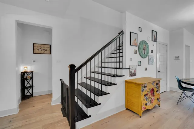 a view of kitchen with furniture and wooden floor