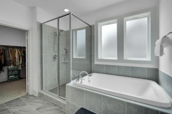 a bathroom with a bathtub and a shower