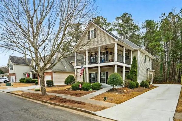 a front view of a house with a yard