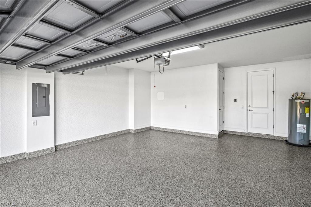 7841 Bristol Circle Naples, FL 34120 - Photo 25 of 31 Garage with electric panel and electric water heater