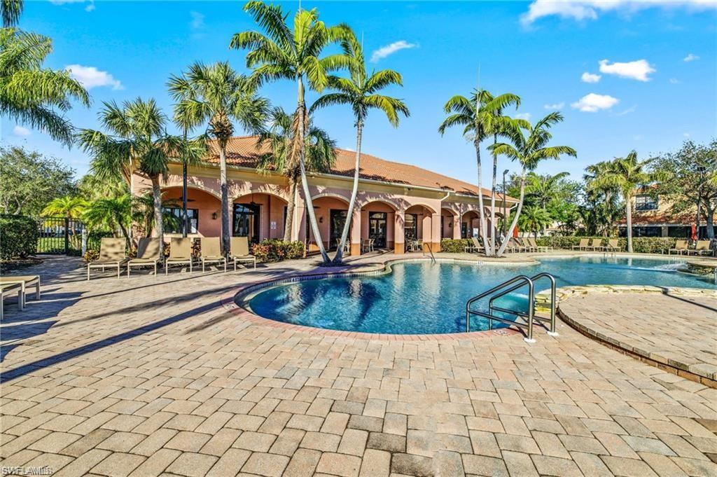 7841 Bristol Circle Naples, FL 34120 - Photo 26 of 31 Community pool featuring a patio area