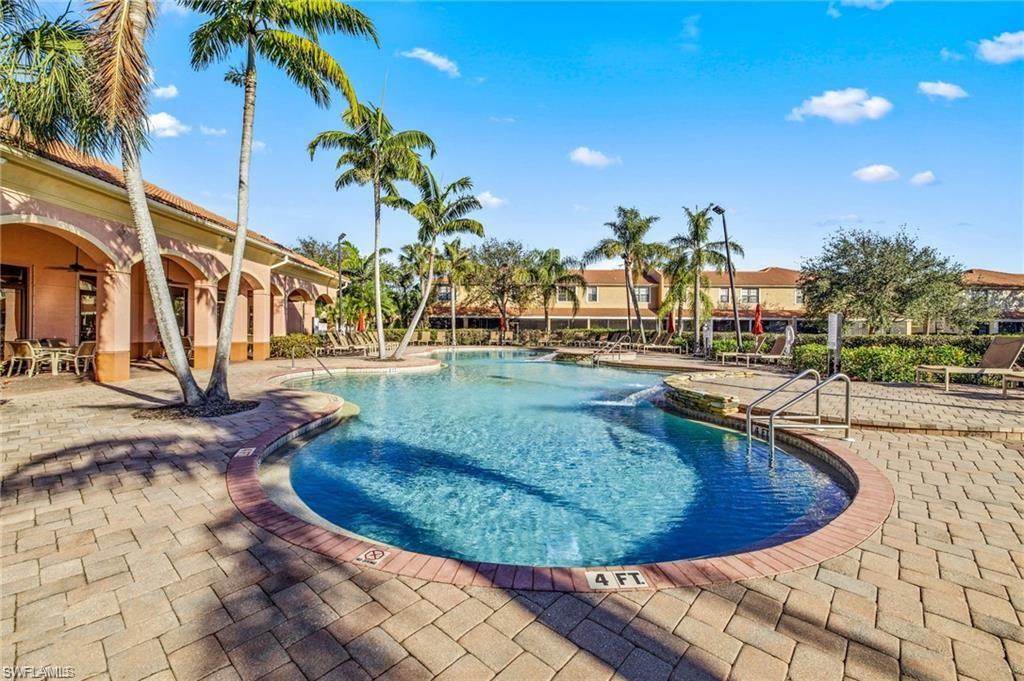 7841 Bristol Circle Naples, FL 34120 - Photo 28 of 31 Community pool featuring a patio