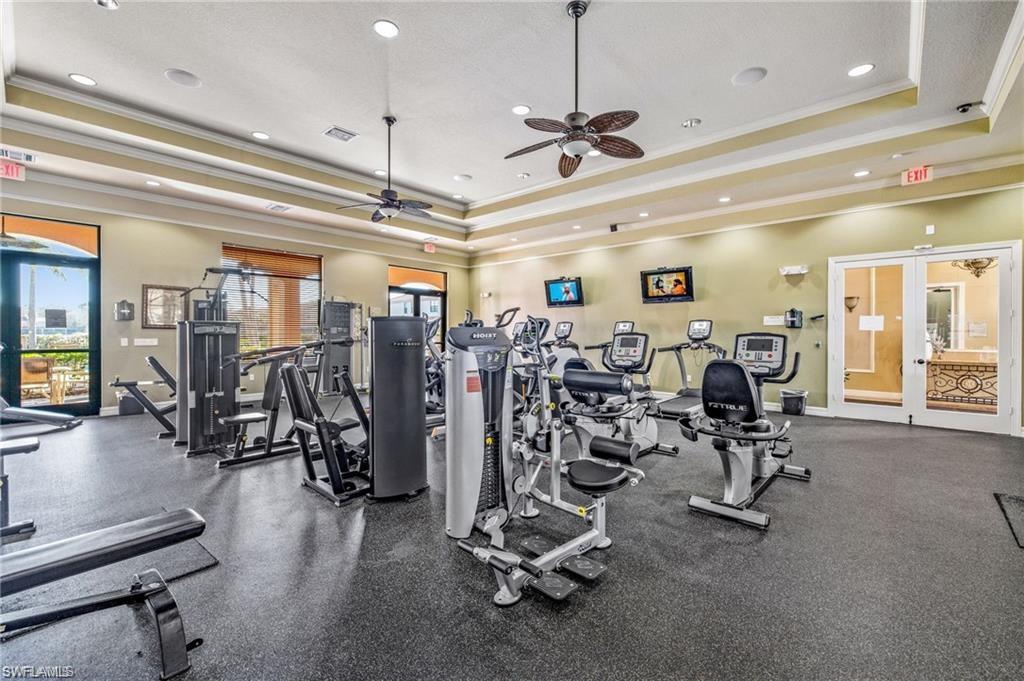7841 Bristol Circle Naples, FL 34120 - Photo 29 of 31 Workout area featuring a tray ceiling, ornamental molding, ceiling fan, and recessed lighting