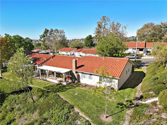an aerial view of a house with a garden