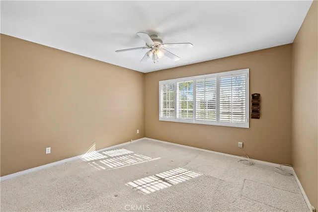 a view of an outdoor dining space with furniture and garden view