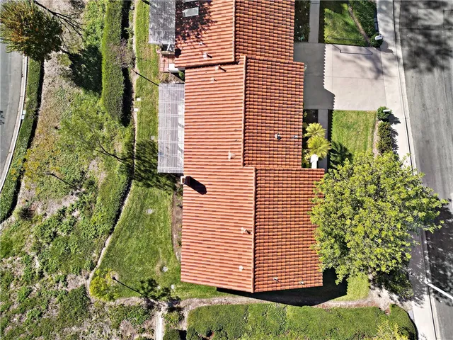 an aerial view of a pool yard tennis courts and mountain view