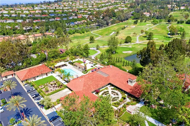 a park view with potted plants and large trees