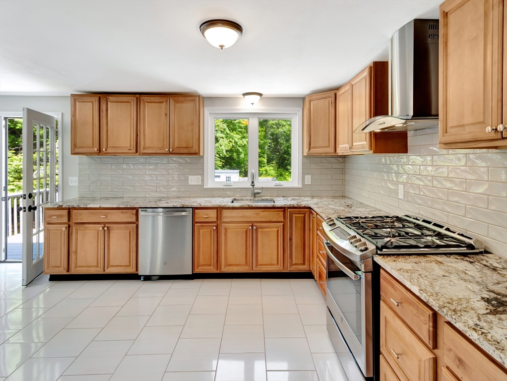 4 Gary Road Norton, MA 02766 - Photo 12 of 42 a kitchen with a stove sink and cabinets