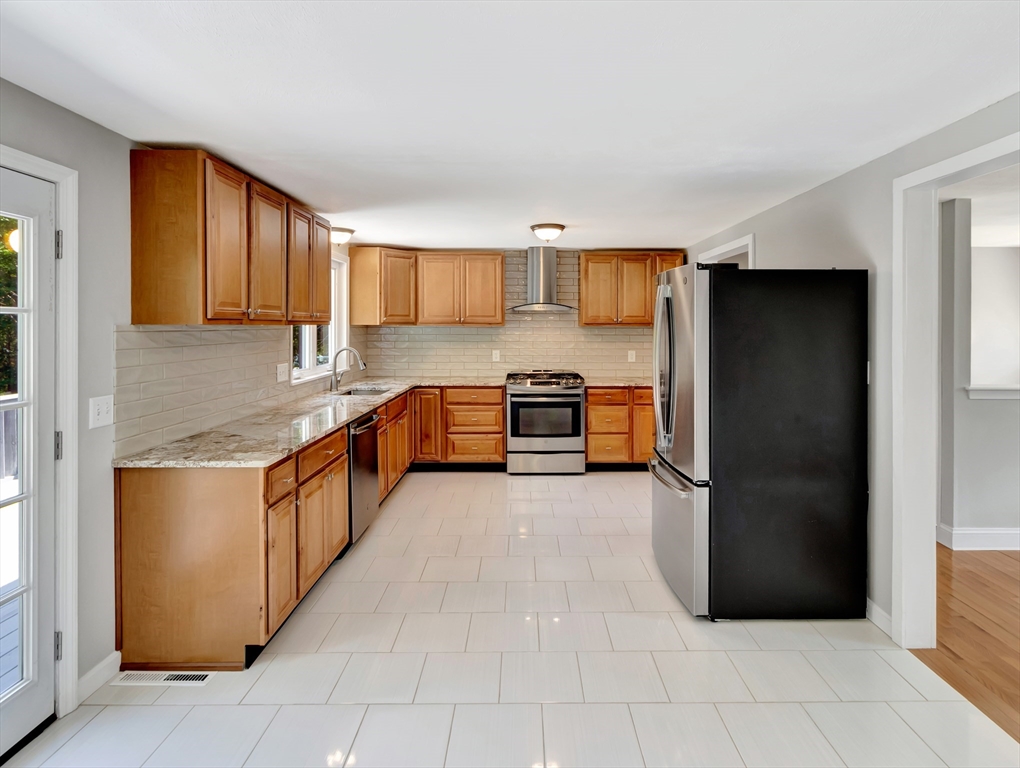 4 Gary Road Norton, MA 02766 - Photo 13 of 42 a large kitchen with stainless steel appliances granite countertop a refrigerator and a sink