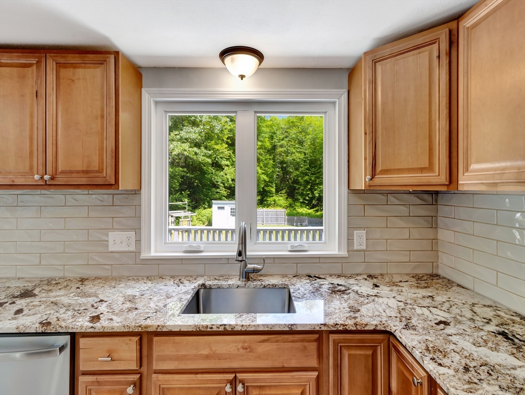 4 Gary Road Norton, MA 02766 - Photo 14 of 42 a kitchen with granite countertop a sink and a window